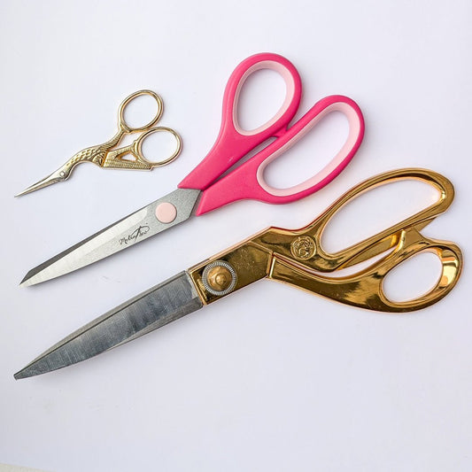 Medium Fabric Scissors shown in relation to the Madam Sew Stork Scissors and the Madam Sew Shears.