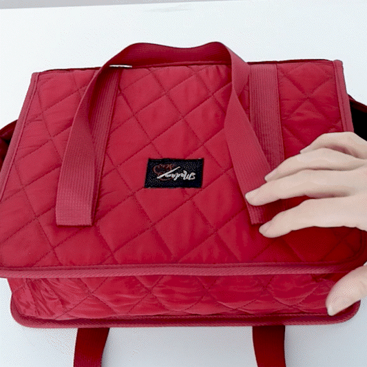 Hands showing the different storing options of the binder bag sewing organizer by Madam Sew