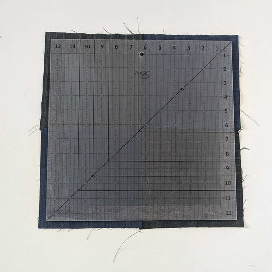 12.5" Square Up ruler shown squaring up block using the guide lines, regular measurements and the whole ruler.