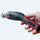 Hand holding Cordless Electric Fabric Scissors by Madam Sew