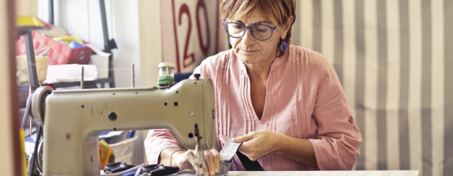 older women sewing with a vintage sewing machine