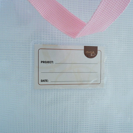 Detail of front card slot with little card that allows you to jot down project details