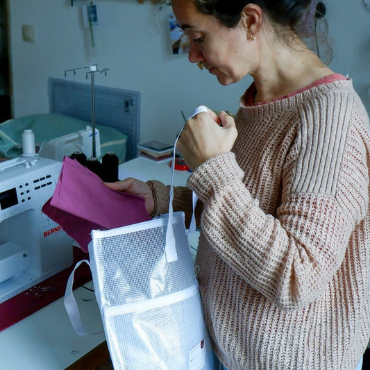 Women storing fabric in the Madam Sew Project Bag