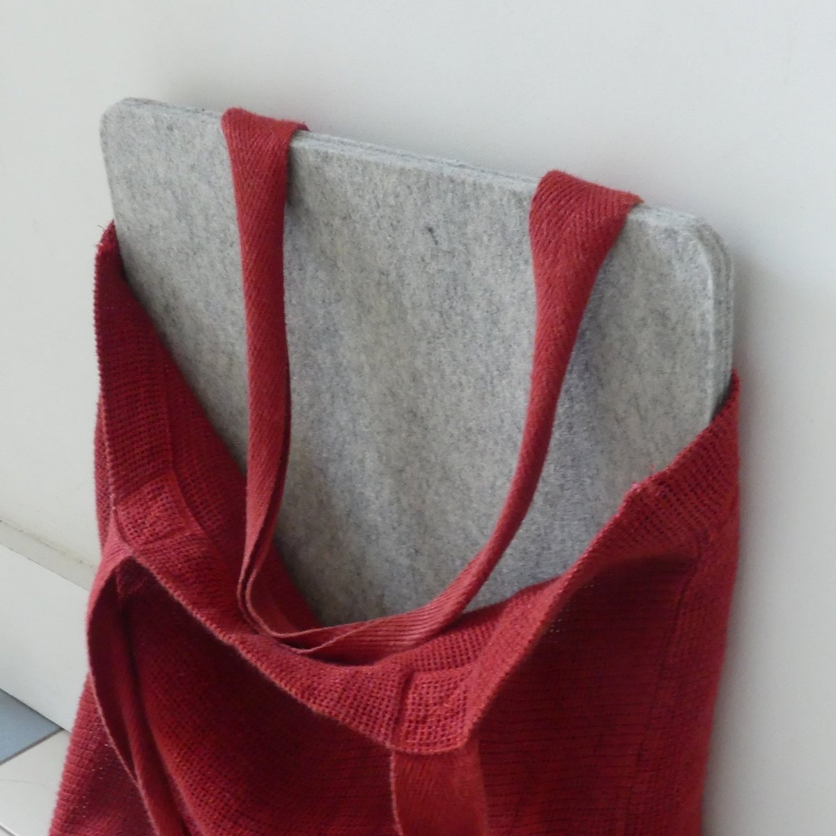 A wool pressing mat in a tote bag