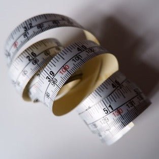 Adhesive Ruler Tape uncoiling.