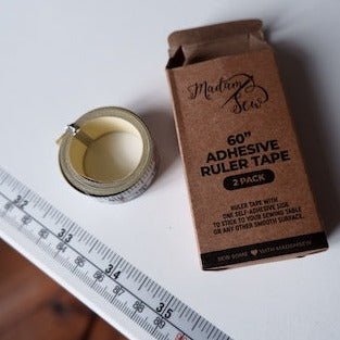 Adhesive Ruler Tape applied to sewing table.