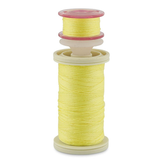 a spool with yellow thread, a bobbin with yellow thread, held together with a bobbin holder