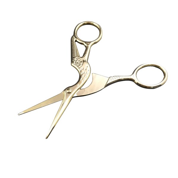Golden classic Stork Design Scissors on a white background in open position