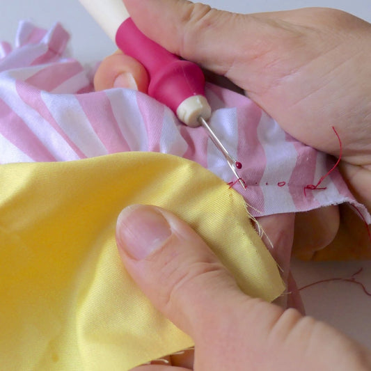 Deluxe Seam Ripper being used to remove seam stitches
