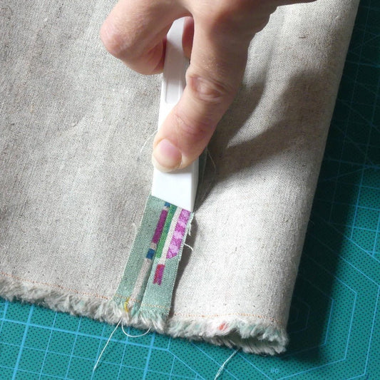 Pressing a seam open with the finger presser