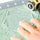 Rotary cutting around a hexagon template with rotary cutter