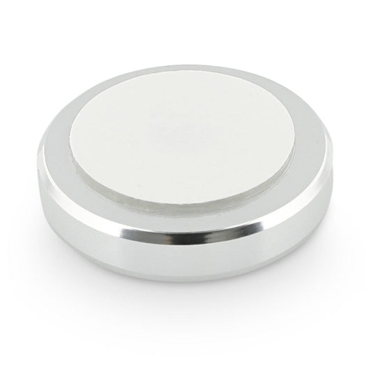 Back of Magic Holder showing the sticker back that is used to adhere this circular magnet to a sewing machine.