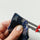 hand pushing out a corner of a little sewn project