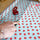 Quilting ruler with a ruler grip used to cut fabric with a rotary cutter