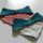 Open Ring Snaps used as a closure on baby bibs.