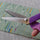 pinking shears with a zigzag edge held by a hand,