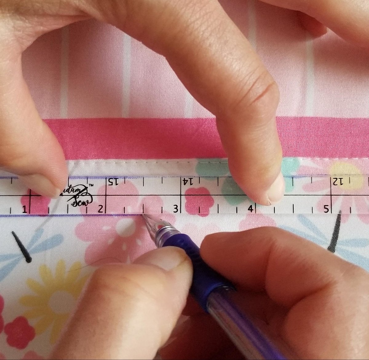 Showing marking 1/2" line on quilt top using the Quarter Inch Patchwork Ruler "QIP"