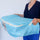Women holding a quilt storage bag