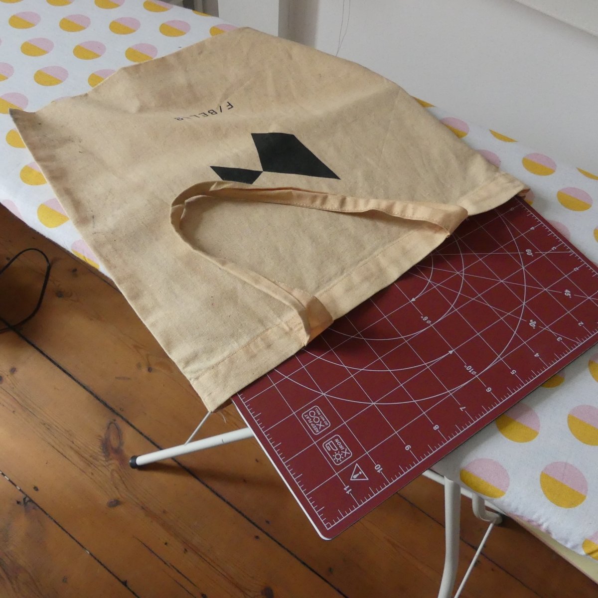 Madam Sew 12 inch rotating cutting mat in a tote bag on a table