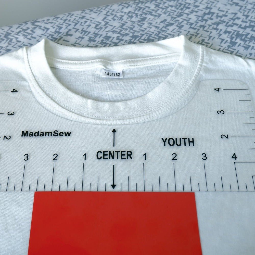 Tshirt ruler on a kid's size t shirt to position a HTV design