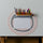 a pencil and marking pen holder on a table with a paper and a round coaster