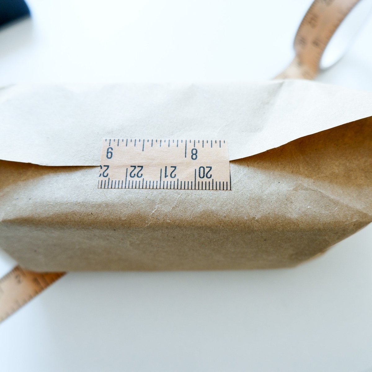MadamSew Vintage Ruler Craft Tape closing the edge of a package