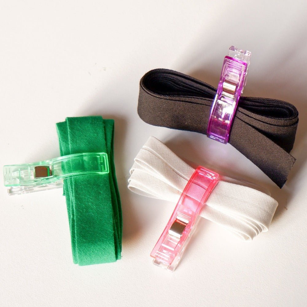 big sewing clips holding bias tape together
