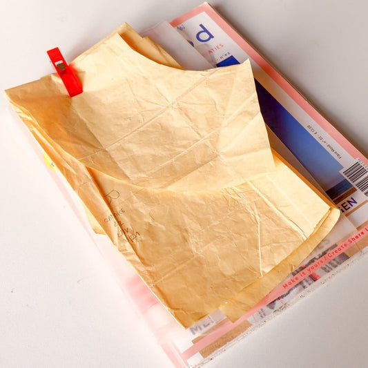 XL clip holding pattern pieces onto the pattern book