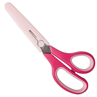 Pink fabric scissors with a sheath on a white background