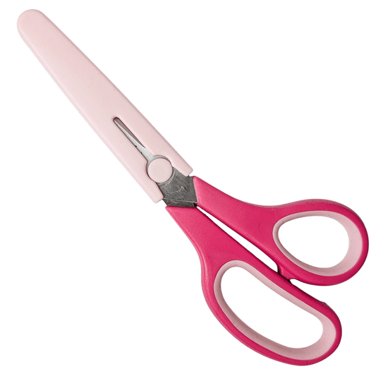 Pink fabric scissors with a sheath on a white background