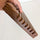 Side view of the Quilting Ruler Holder showing the slots for rulers.