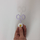 Light purple snips being inserted and removed from cute daisy topper.
