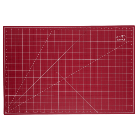 A red A1 cutting mat with white grid lines, measurement markings, and a small white Madam Sew logo in the top right corner, shown flat against a white background.