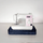 Animation of a sewing machine on a navy quilted base, covered into a zipped bag, then lifted by its strap