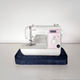 Animation of a sewing machine on a navy quilted base, covered into a zipped bag, then lifted by its strap