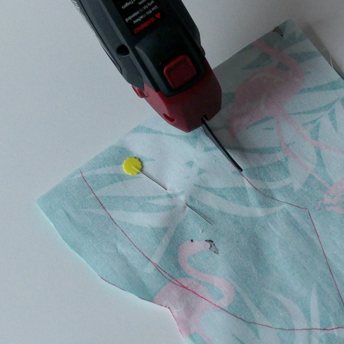 Cut on marked lines with electric fabric scissors