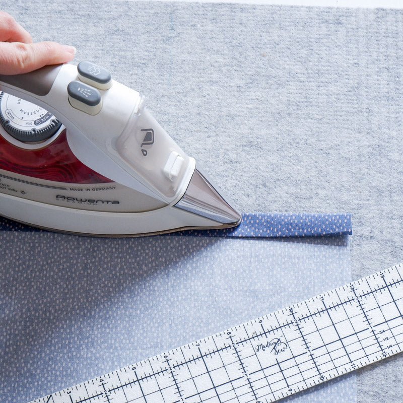 ironing a double folded hem with a hot hem ruler