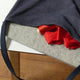 Wool pressing mat in a bag with fabric and thread