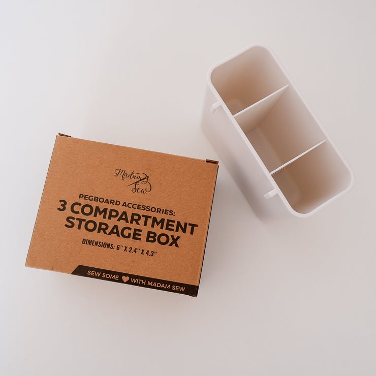 3-compartment storage box for Madam Sew Peg Board with the packaging on a table
