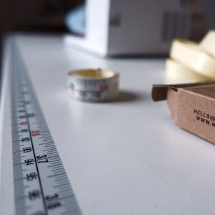 MadamSew Adhesive Ruler Tape adhered to a work surface.