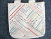 A tote bag that has been embellished using the Border Guide Presser Foot.