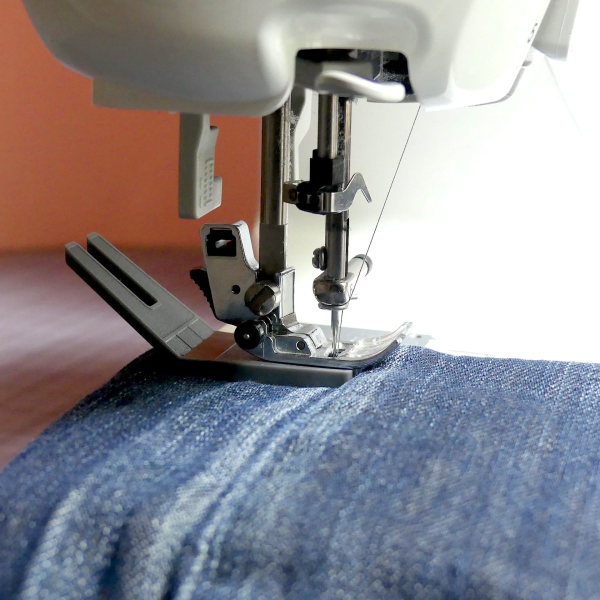 Bulky Seam Jumper going over a seam on jeans.
