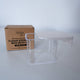 clear plastic box with a white lid and a cardboard box