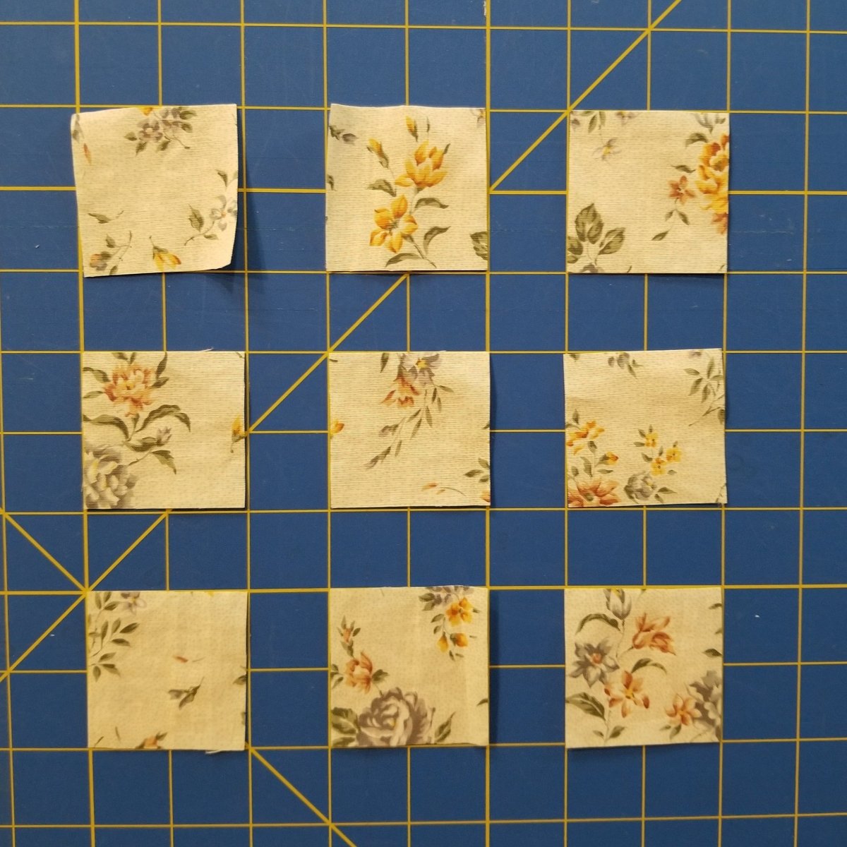 Fabric squares cut with the Creative Shape Cut Ruler