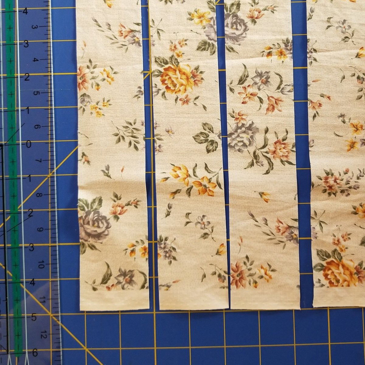 Strips of fabric cut with the Creative Shape Cut Ruler