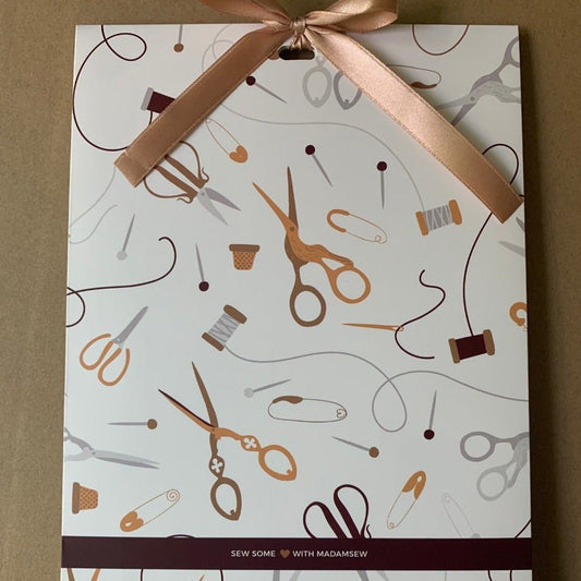 A gift bag for a sewist with scissors drawings
