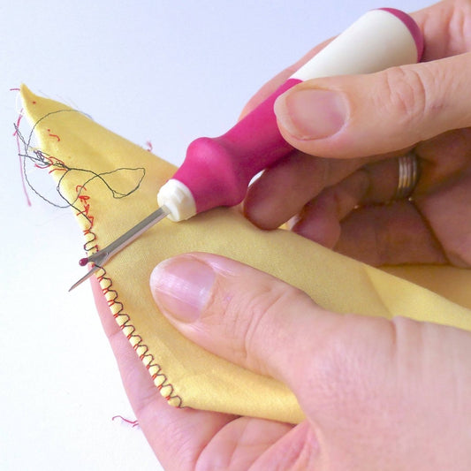 Deluxe Seam Ripper being used to take out edge stitches
