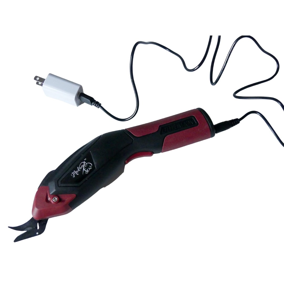 Madam Sew Electric Fabric Scissors plugged into charger