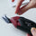 Removing screw from electric fabric scissors