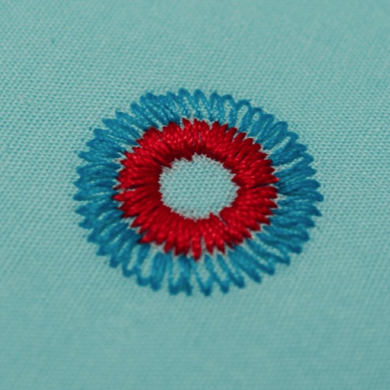 Circular design made with Flower Stitch Presser Foot